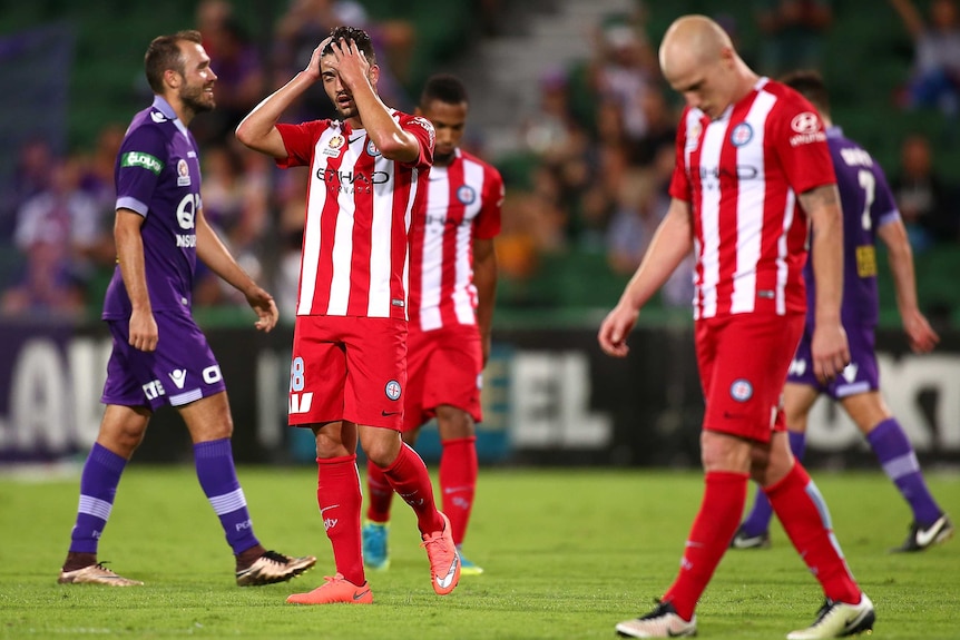 Melbourne City players trudge off the field after losing to Perth Glory