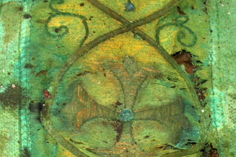 Close up of the green chasuble WA's first bishop was wearing when he was buried.