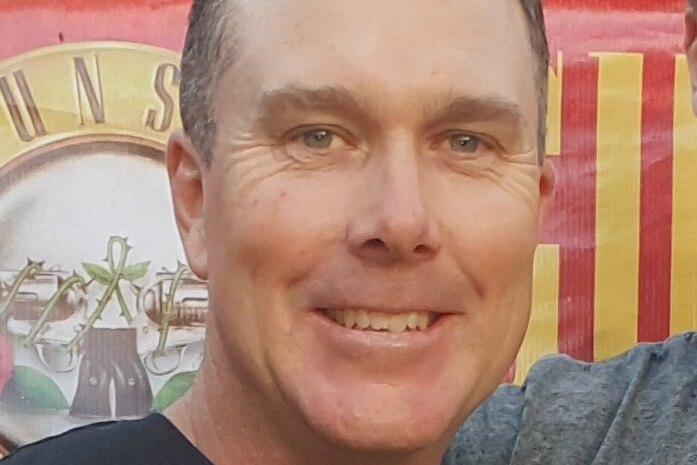 a close up photo of a man smiling