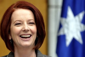Julia Gillard laughs during a press conference (AAP: Alan Porritt)