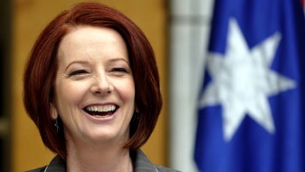 Julia Gillard laughs during a press conference (AAP: Alan Porritt)