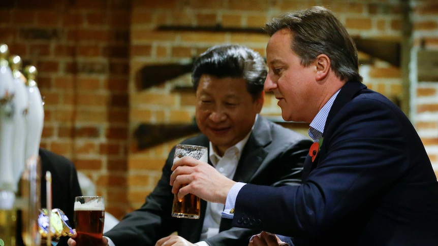 David Cameron takes Xi Jinping to traditional British pub.jpg