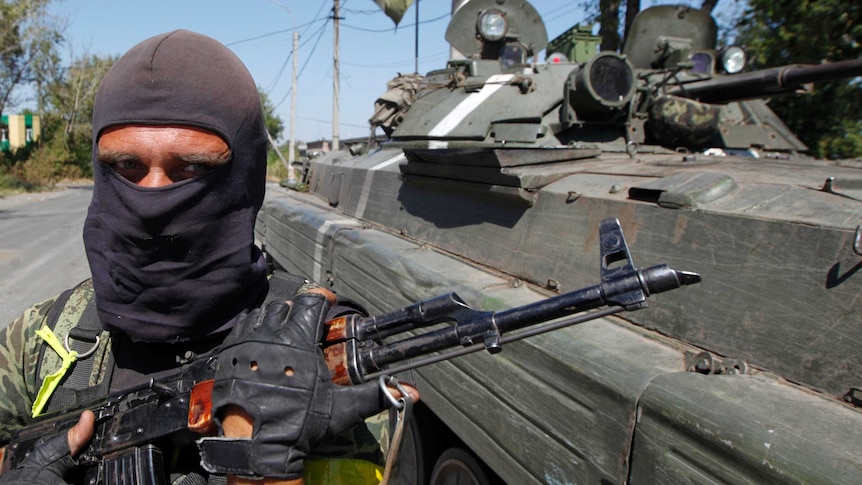 Ukraine soldier guards a checkpoint on the border