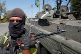 Ukraine soldier guards a checkpoint on the border