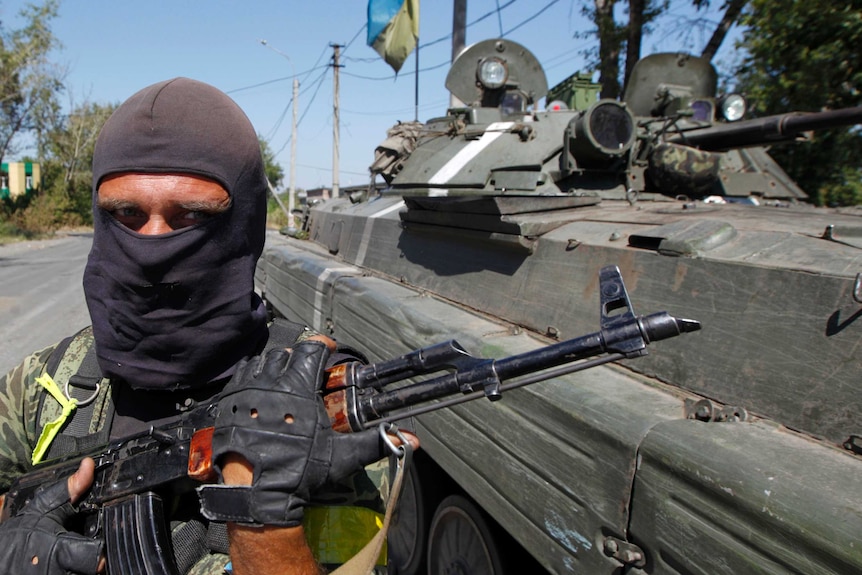 Ukraine soldier guards a checkpoint on the border