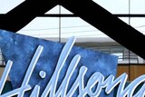The Hillsong sign sits on the entrance to the Hillsong Church