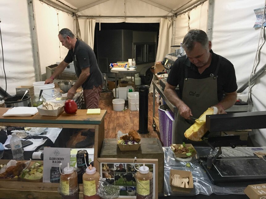 Cheesemakers Kerry and Paul Wilson busy preparing food.