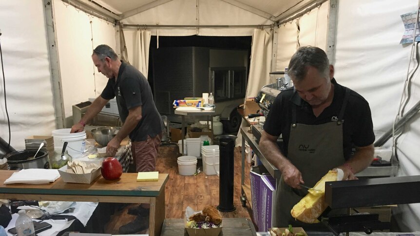 Cheesemakers Kerry and Paul Wilson busy preparing food.