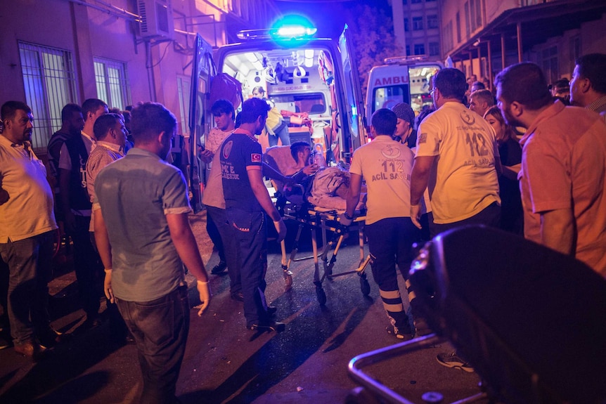 First aid officers carry an injured man to hospital in Turkey.