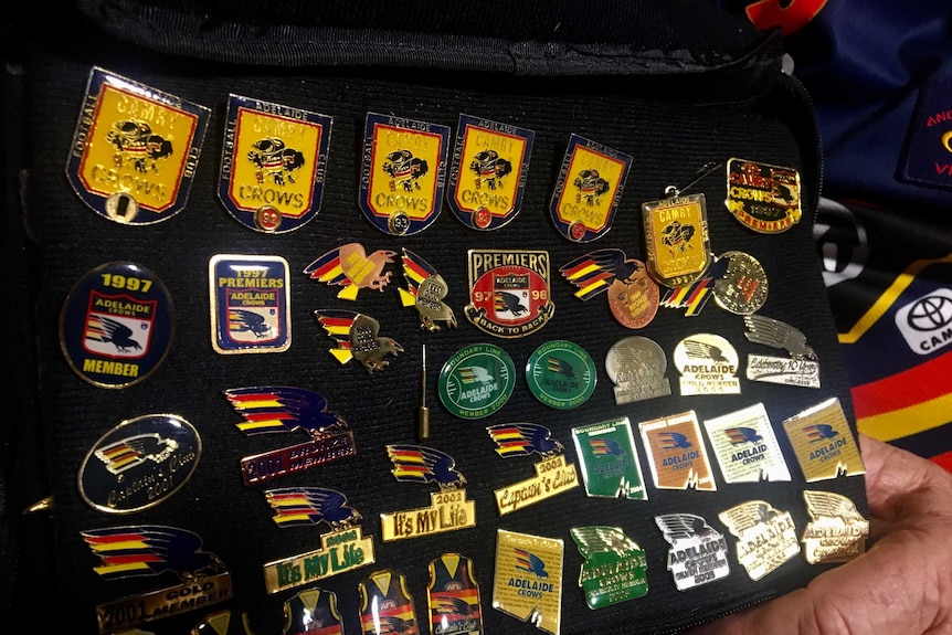 A collection of Adelaide Crows badges