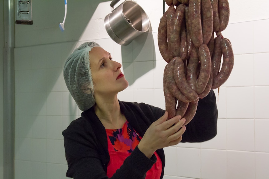 Chrissy Flanagan checks the made sausages