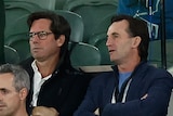Gillon McLachlan and Andrew Dillon on the sidelines at an AFL match.