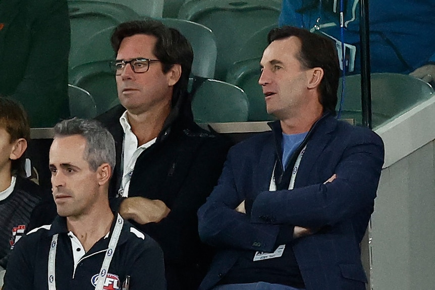 Gillon McLachlan and Andrew Dillon on the sidelines at an AFL match.