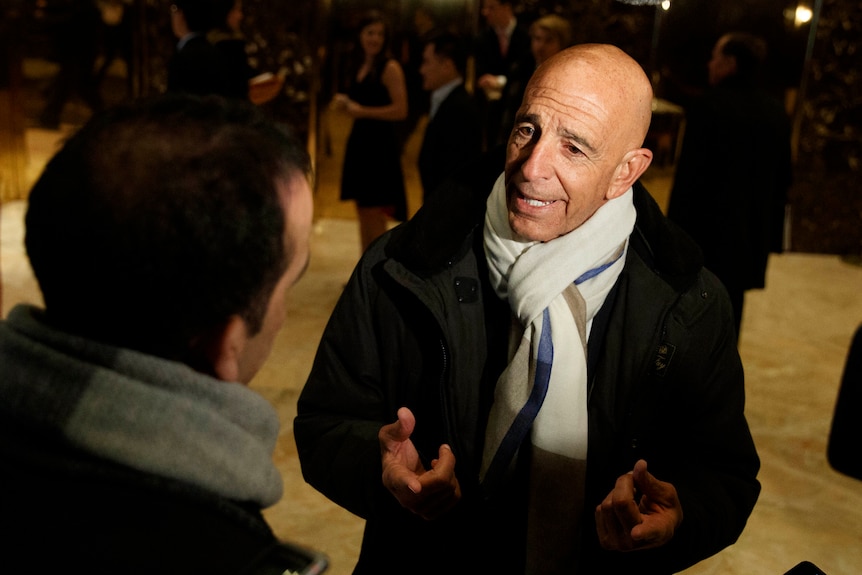 Tom Barrack speaking with reporters in the lobby of Trump Tower