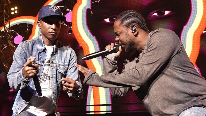 Pharrell Williams (L) and Kendrick Lamar perform during Power 106 Cali Christmas at The Forum on December 4, 2015