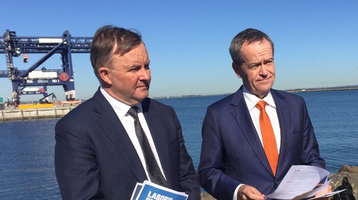 Anthony Albanese and Bill Shorten stand together in the sun.