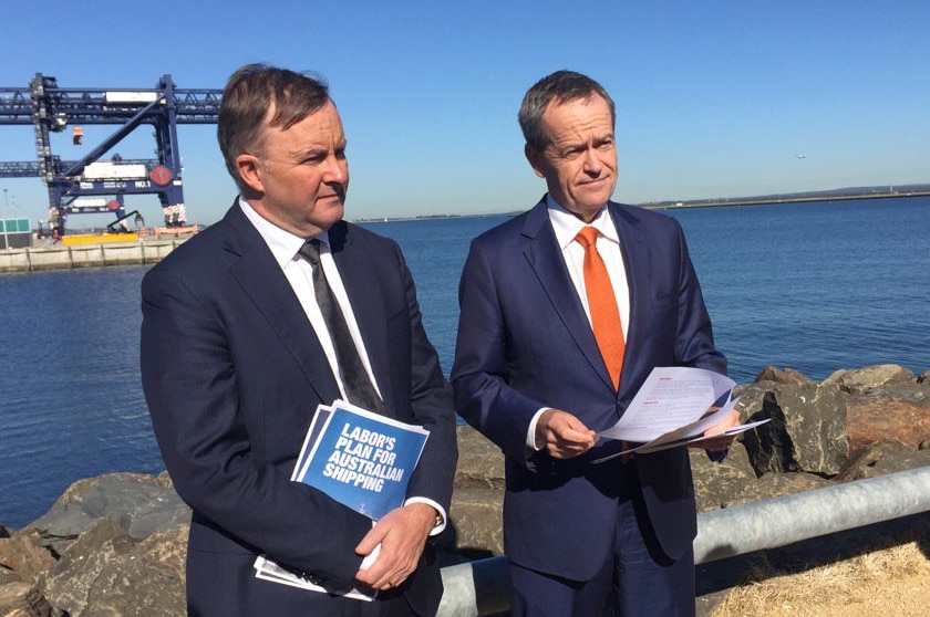 Anthony Albanese and Bill Shorten stand together in the sun.