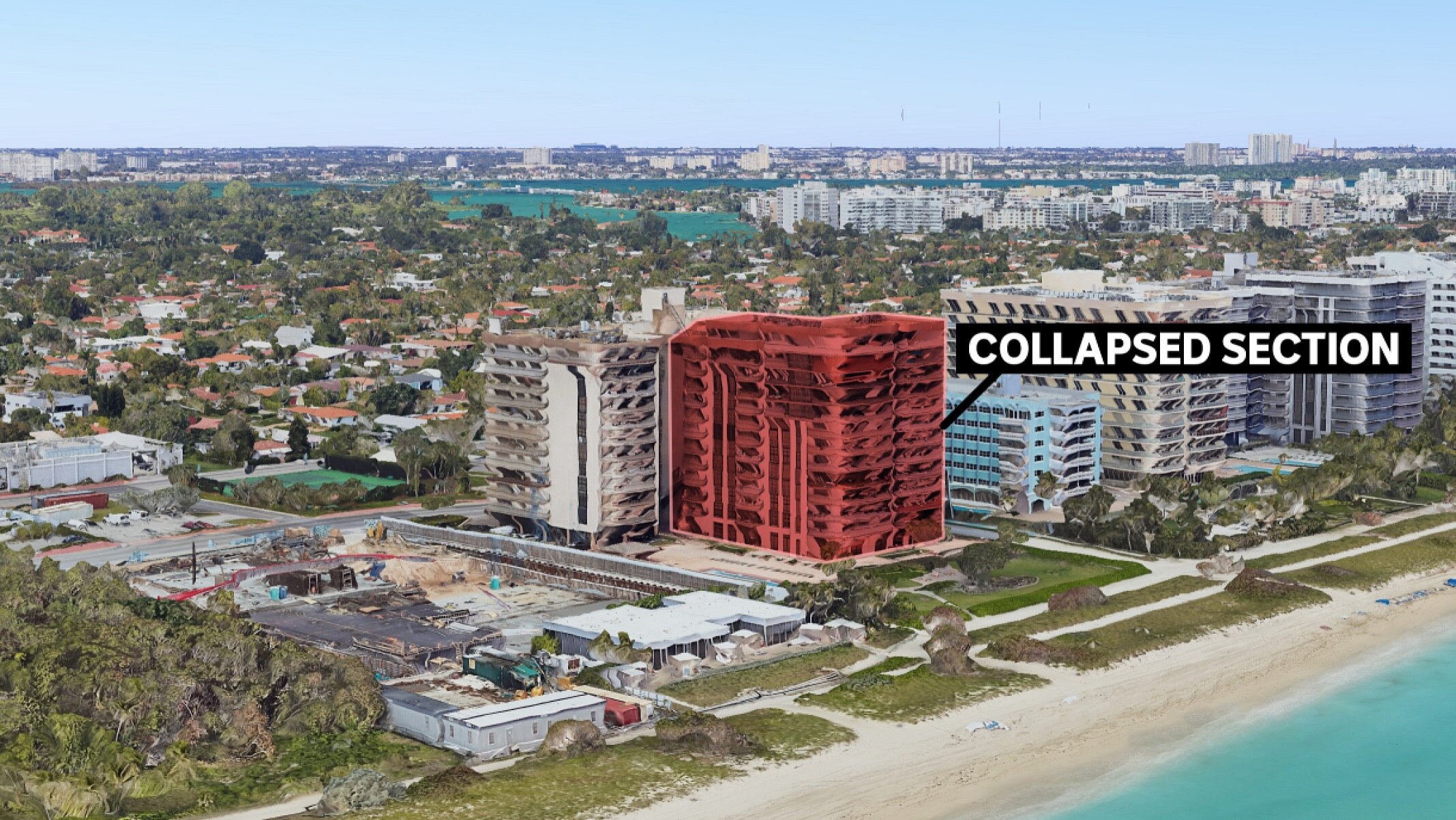 Image of apartment complex on coast, with one building highlighted in red.