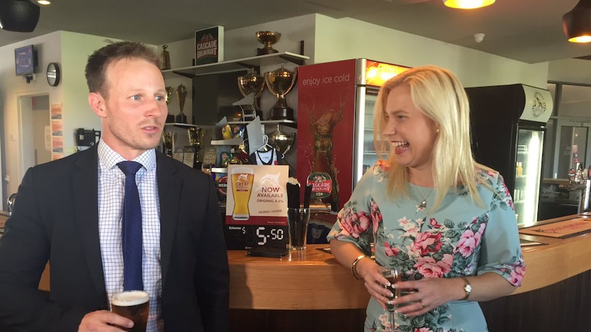 Matt Stevenson and Kristie Johnston celebrate at bar.