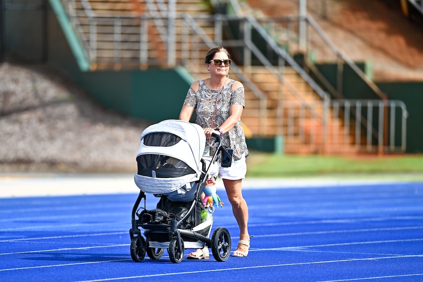 Katrina Gorry's mum, Linda waling baby Harper around the track.