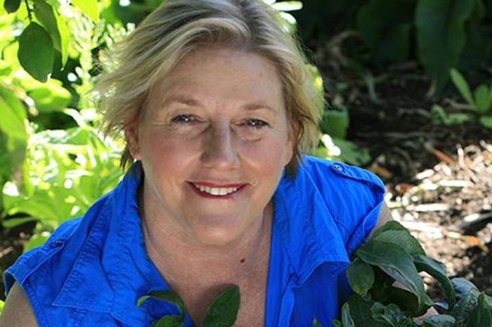 Gardening guru Sabrina Hahn smiles as she works in the garden