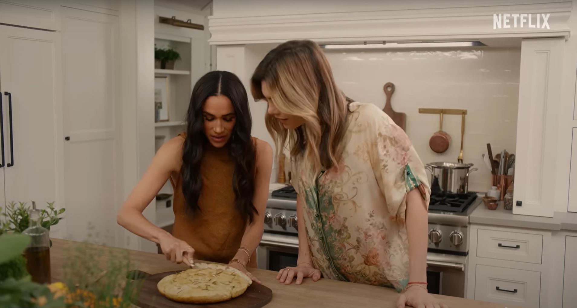 Meghan Markle is seen cooking, gardening and sharing recipes with friends in the trailer. 