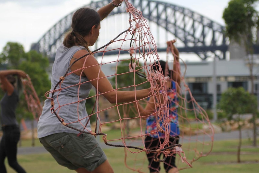 A dancer from the Jannawi Dance Clan practices a contemporary net routine at Barangaroo for Australia Day.