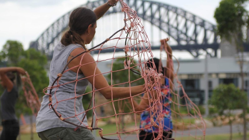 A dancer from the Jannawi Dance Clan practices a contemporary net routine at Barangaroo for Australia Day.