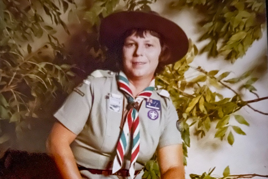 An older photo of a woman wearing scout gear