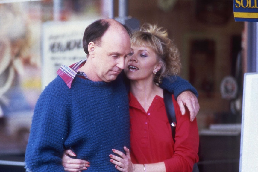 John Clarke with an arm around Deborra-Lee Furness on the set of 1987 movie A Matter of Convenience.