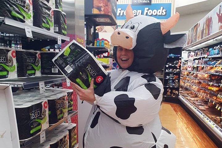 woman with toilet paper in a cow outfit