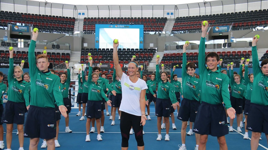 Sam Stosur joins the ballkids of the Brisbane International for a training drill
