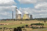 Loy Yang power plant in Victoria with steam coming out of the stacks