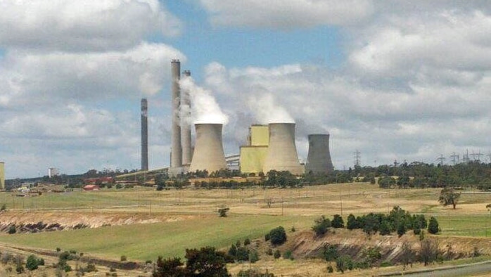 Loy Yang power plant in Victoria with steam coming out of the stacks.