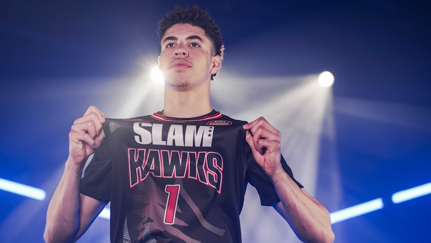 Illawarra Hawks player LaMelo Ball shows off his number one NBL jersey during a promotional photoshoot.