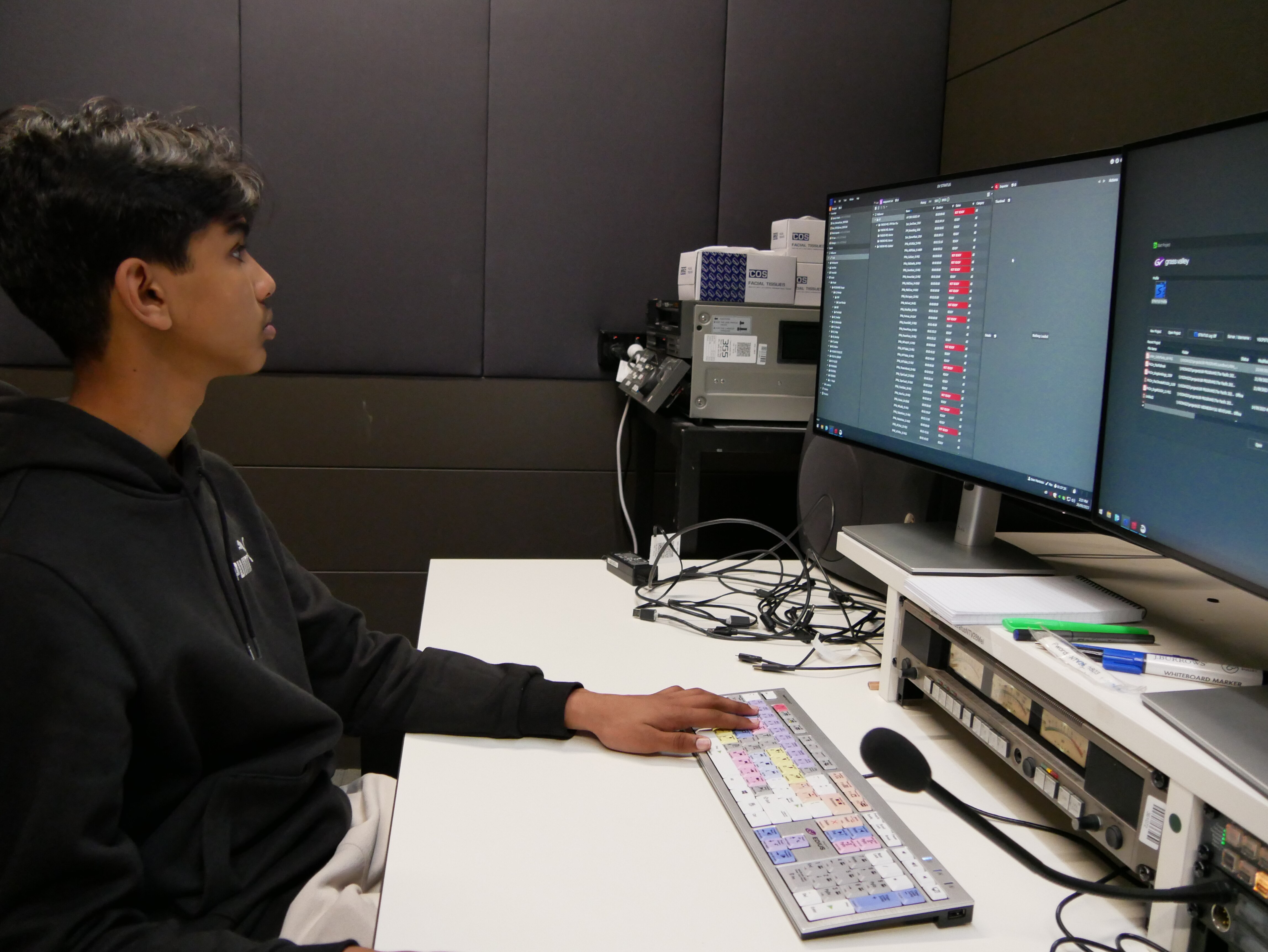 A boy sitting at a computer