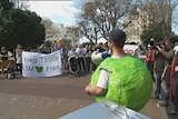 Yesterday, more than 100 protesters marched through Hobart, demanding the Government continue its ban on GM crops.