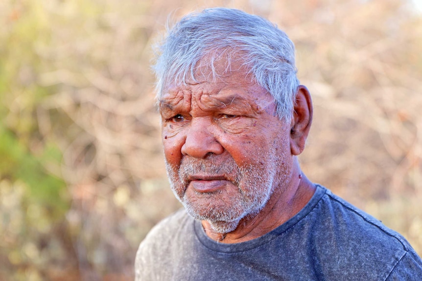A portrait shot of an elderly Aboriginal man.