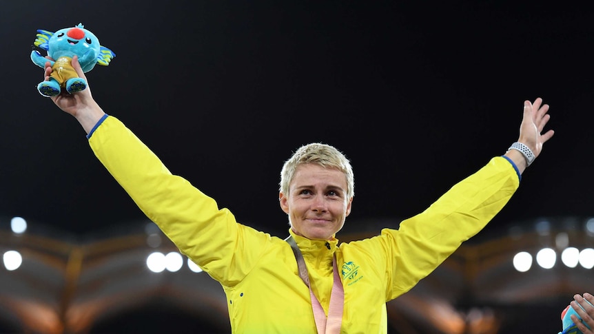 A teary Kathryn Mitchell on the podium at the Commonwealth Games