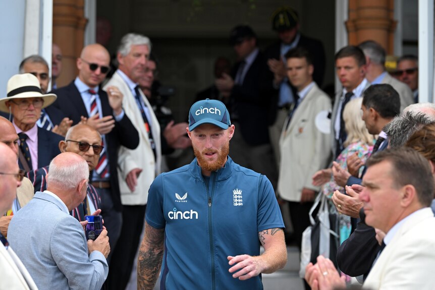 Ben Stokes walks down the stairs