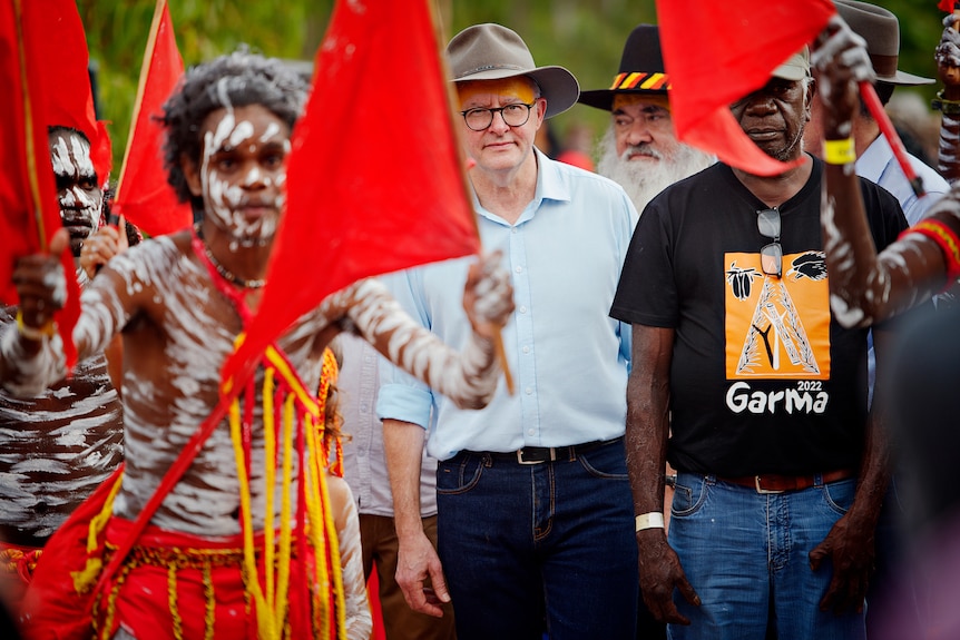 Anthony Albanese walks with dancers at the 2022 Garma Festival opening ceremony