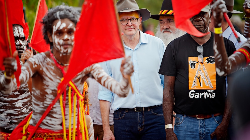Anthony Albanese walks with dancers at the 2022 Garma Festival opening ceremony