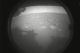A grainy black and white image of a Martian landscape.