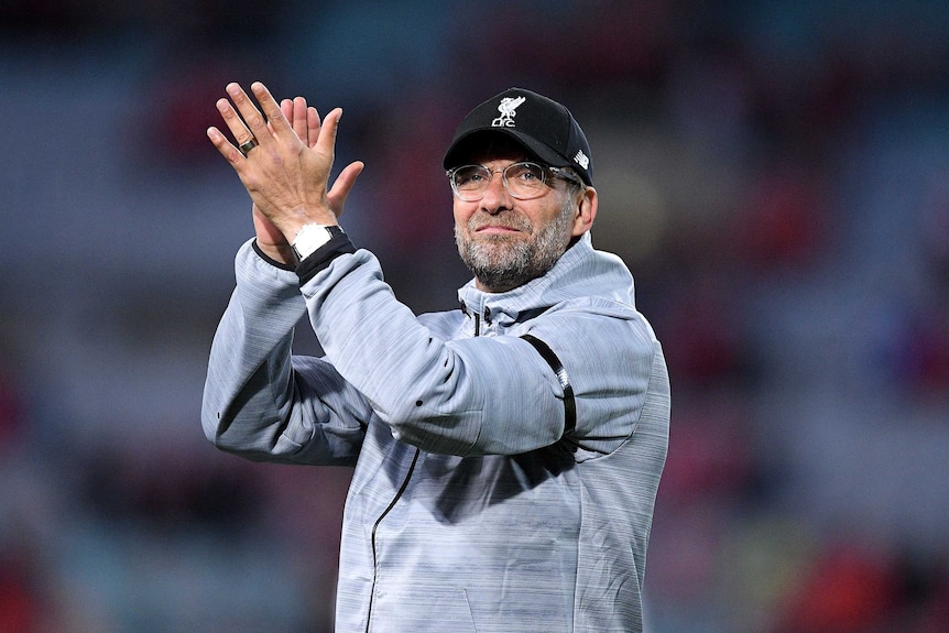 Liverpool manager Jurgen Klopp gestures to supporters following the win over Sydney FC.