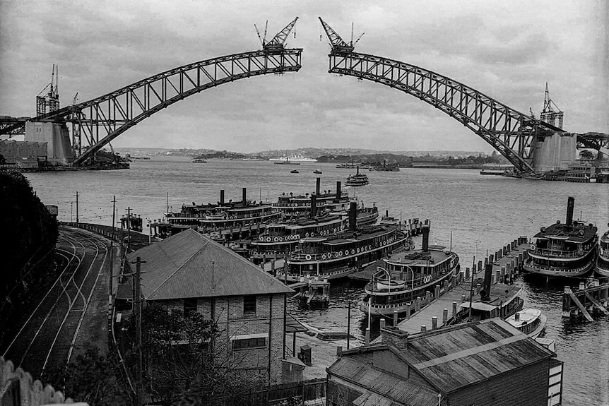 an old image of the harbour bridge being built