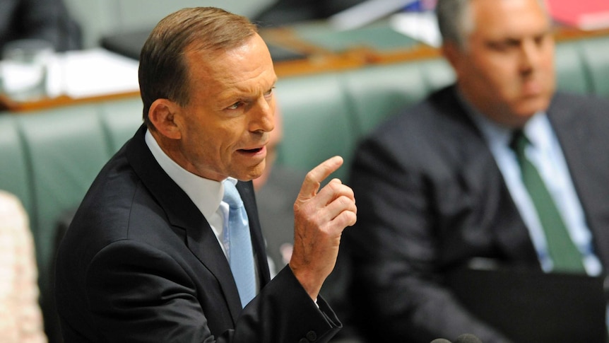 Tony Abbott gestures during Question Time on October 9, 2012.