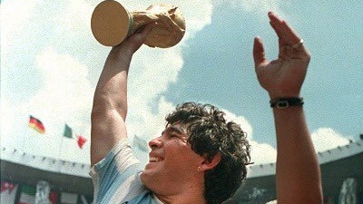Diego Maradona lifting the World Cup trophy in the air after Argentina beat West Germany.