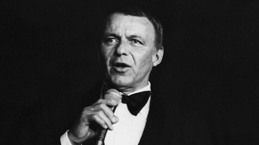 Black-and-white image of Frank Sinatra, in performance; circa 1970; New York.