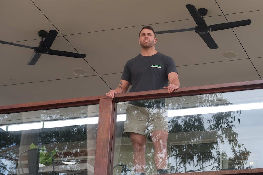 Keiran Edwards on the balcony of his home