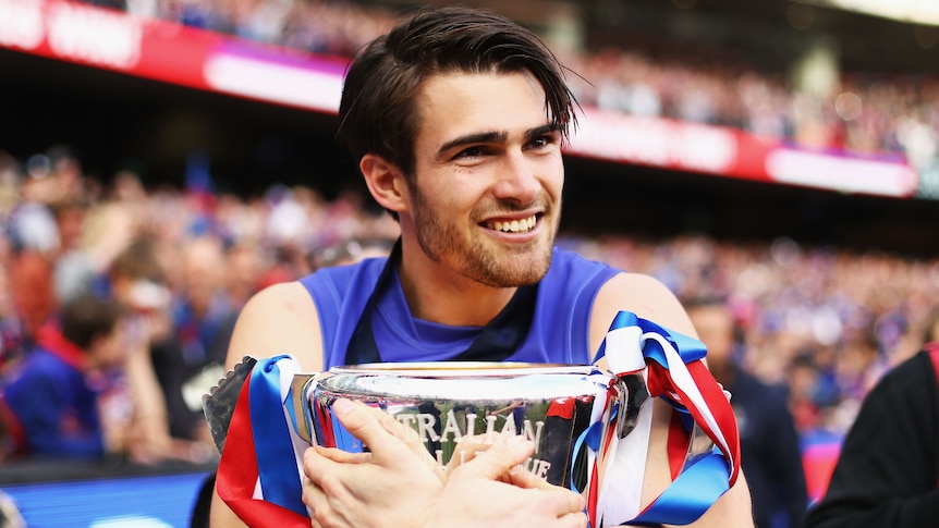 Western Bulldogs premiership captain Easton Wood retires after 14-year AFL career